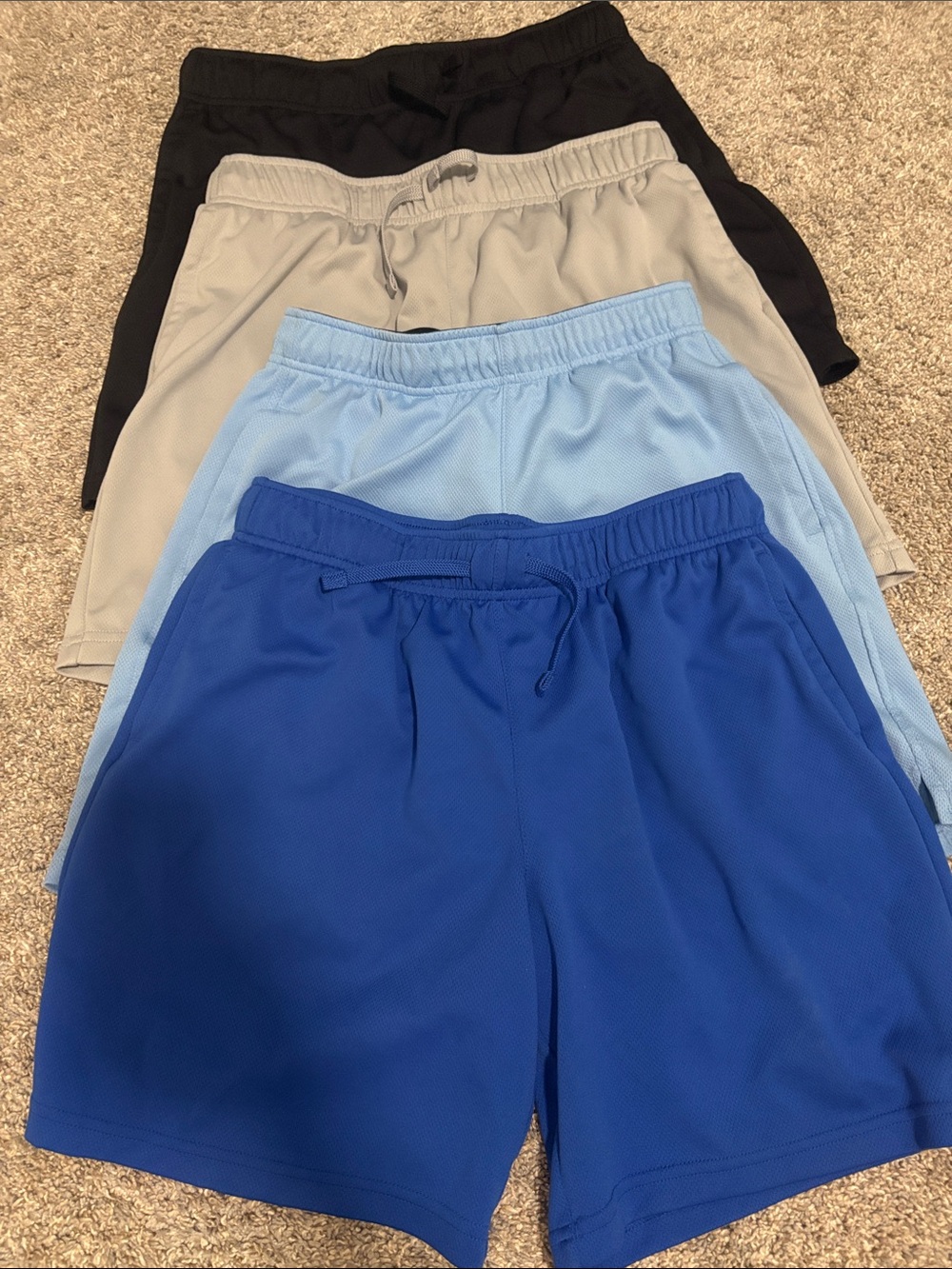 4 pairs of like new Tek Gear athletic shorts Large husky